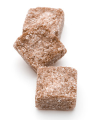 Brown lump cane sugar cube isolated on white background cutout