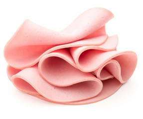 cooked boiled ham sausage or rolled bologna slices isolated on w © Natika