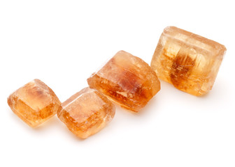 Brown caramelized lump cane sugar cube isolated on white backgro