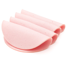 cooked boiled ham sausage or rolled bologna slices isolated on w © Natika