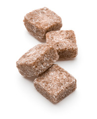 Brown lump cane sugar cube isolated on white background cutout