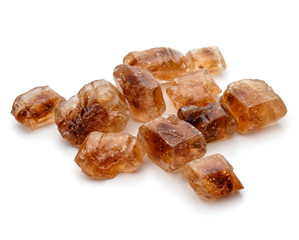 Brown caramelized lump cane sugar cube isolated on white backgro