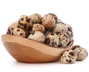 quail eggs in wooden bowl isolated on white background cutout