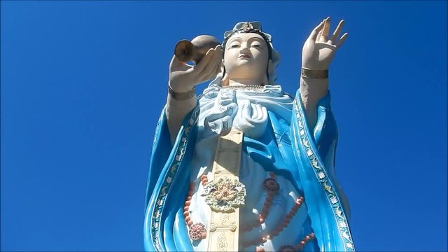 Buddha statue on blue sky background