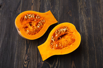 pumpkin slices on a black wooden background
