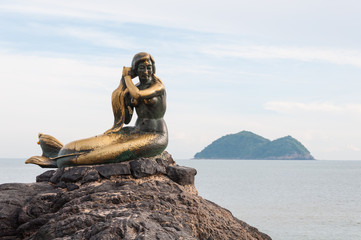 The mermaid statue on the rock