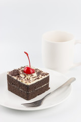 Chocolate cake with cherries on white background