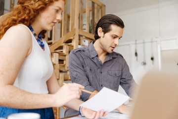 Two young architects in office