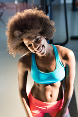 Fototapeta na wymiar A young afro american woman standing in a gym