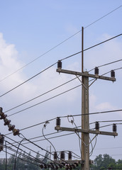 High voltage electricity pole with blue clear sky background