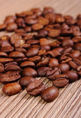 Heap of coffee on wooden background