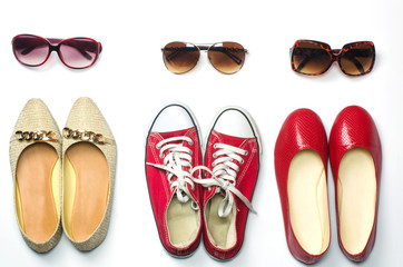 Placed shoes and sunglasses on a white background styles - lifestyles