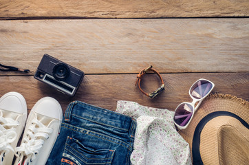 Travel accessories and costume on wooden floor