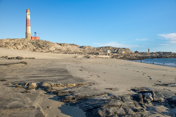 Lighthouse in front of beach