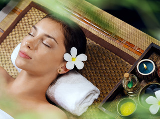 portrait of young beautiful woman in spa environment