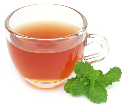 Herbal tea in a cup with mint leaves