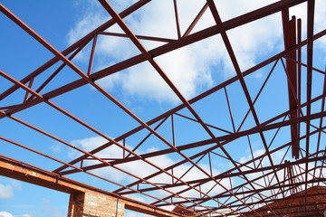Roofing Construction. Steel roof trusses details with clouds sky