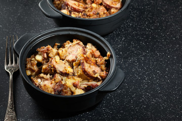 Potatoes baked with sausage and bacon