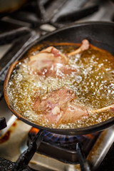 Duck legs frying