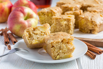 Homemade blondie (blonde) brownies apple cake, square slices on plate