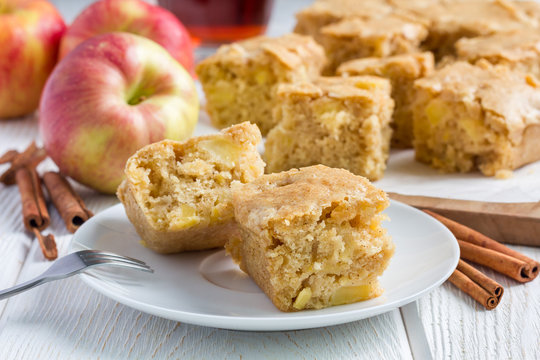 Homemade blondie (blonde) brownies apple cake, square slices on plate