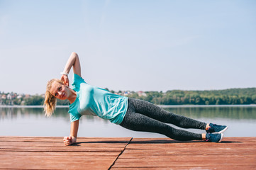 She performs exercises on pier