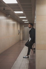 Fototapeta premium Handsome Indian man posing in a metro station