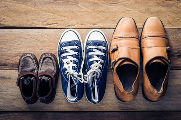 Three pairs of shoes, three stages of the growth.