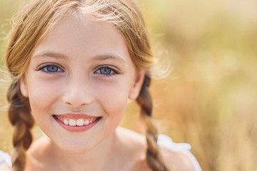 Innocent female child expressing positive emotions