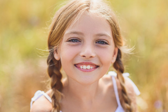 Joyful Female Kid Smiling With Happiness