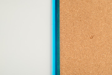 Fototapeta premium A white board and a cork board in one blue frame
