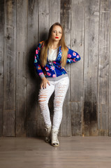 girl wearing blue cardigan.Isolated studio portrait