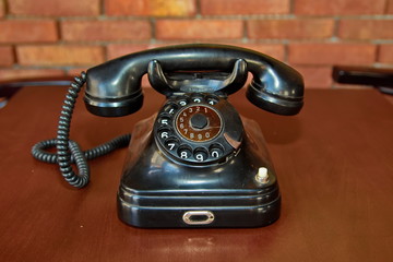 An old telephone with rotary dial