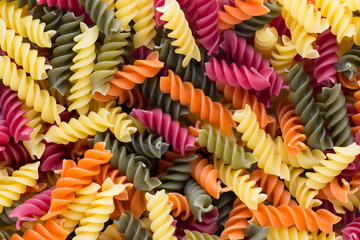 Closeup of raw eco macaroni pasta background.