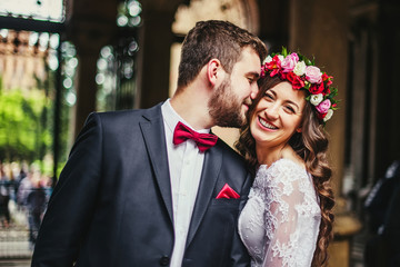Groom and bride near the columns
