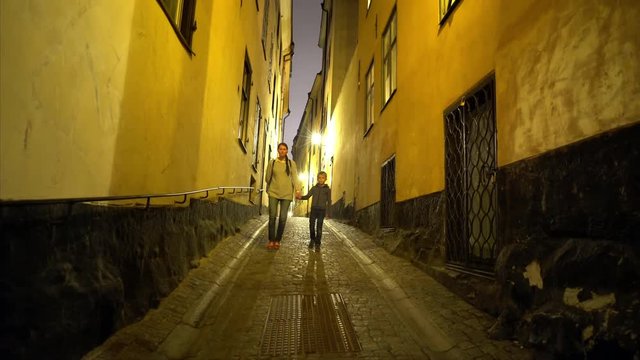 A mother and her son strolling the streets of Stockholm´s old town (Gamla Stan).