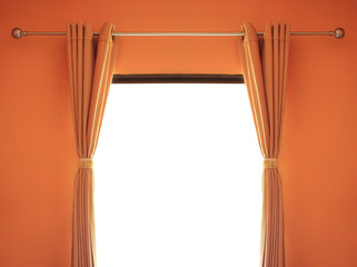 orange room have a window with blinds.