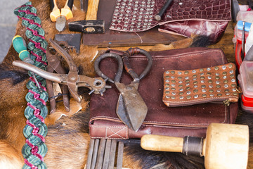 assortment of antique tools to work leather
