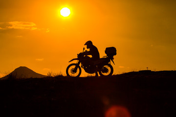 Fototapeta na wymiar silhouette of the mountain motor drive