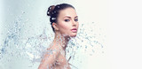 Beautiful spa woman with splashes of water