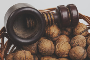 Walnuts in a willow basket with nutcracker