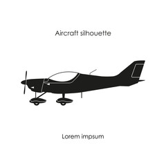 Black silhouette of a sports plane on a white background. Isolat