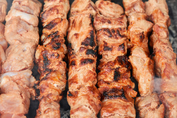 Preparation of a shish kebab on a brazier of hot coals