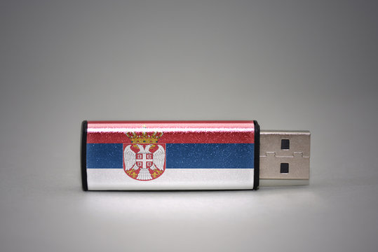 usb flash drive with the national flag of serbia on gray background. - Powered by Adobe