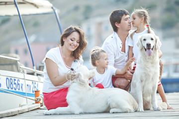 Family and dog resting outdoors 
