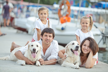 Family and dog resting outdoors 