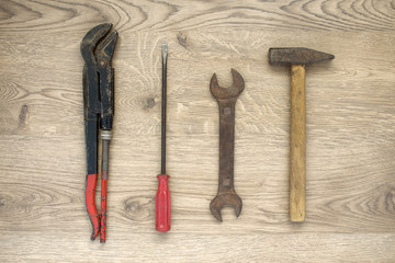 Old tools on wooden background
