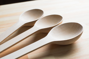 big wooden spoon on the table © danilishina_30
