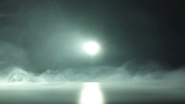 The moolight on the background of thick smoke. Slow motion capture