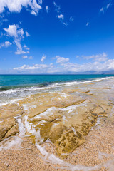 A view of beautiful beach with turquoise sea water and sandy beach. Corfu island. Greece
